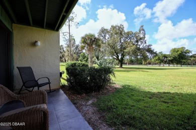 Nestled in the highly sought-after Sugar Mill Golf Townhomes on Sugar Mill Country Club in Florida - for sale on GolfHomes.com, golf home, golf lot