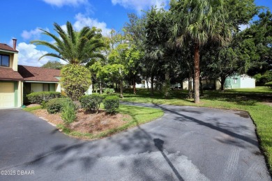 Nestled in the highly sought-after Sugar Mill Golf Townhomes on Sugar Mill Country Club in Florida - for sale on GolfHomes.com, golf home, golf lot