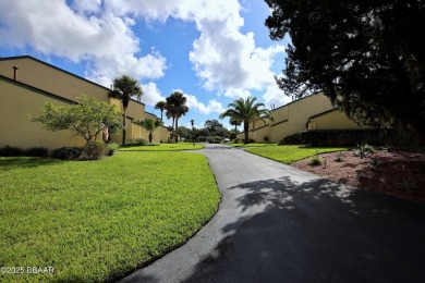 Nestled in the highly sought-after Sugar Mill Golf Townhomes on Sugar Mill Country Club in Florida - for sale on GolfHomes.com, golf home, golf lot