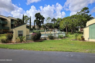 Nestled in the highly sought-after Sugar Mill Golf Townhomes on Sugar Mill Country Club in Florida - for sale on GolfHomes.com, golf home, golf lot