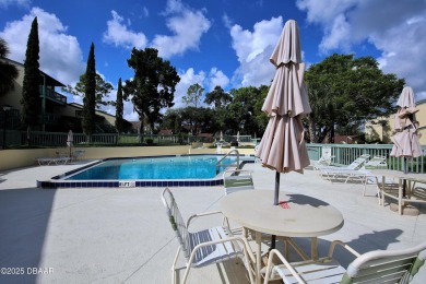 Nestled in the highly sought-after Sugar Mill Golf Townhomes on Sugar Mill Country Club in Florida - for sale on GolfHomes.com, golf home, golf lot