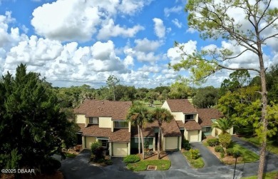 Nestled in the highly sought-after Sugar Mill Golf Townhomes on Sugar Mill Country Club in Florida - for sale on GolfHomes.com, golf home, golf lot