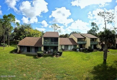 Nestled in the highly sought-after Sugar Mill Golf Townhomes on Sugar Mill Country Club in Florida - for sale on GolfHomes.com, golf home, golf lot