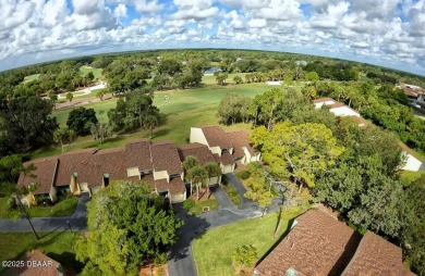 Nestled in the highly sought-after Sugar Mill Golf Townhomes on Sugar Mill Country Club in Florida - for sale on GolfHomes.com, golf home, golf lot