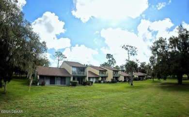 Nestled in the highly sought-after Sugar Mill Golf Townhomes on Sugar Mill Country Club in Florida - for sale on GolfHomes.com, golf home, golf lot