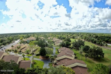 Nestled in the highly sought-after Sugar Mill Golf Townhomes on Sugar Mill Country Club in Florida - for sale on GolfHomes.com, golf home, golf lot