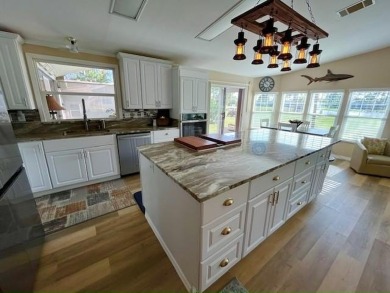 A SHOW STOPPER! Renovated 2bd/2ba home on Lake/Golf course. 1736 on Del Tura Golf and Country Club in Florida - for sale on GolfHomes.com, golf home, golf lot