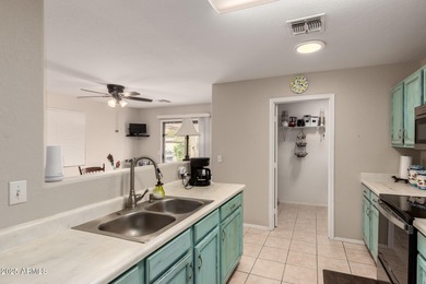 Single-story home on a premium corner lot with a pool in Johnson on The Golf Club At Johnson Ranch in Arizona - for sale on GolfHomes.com, golf home, golf lot