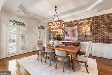 An exceptional entry point into The Manor Golf & Country Club on Manor Golf and Country Club in Georgia - for sale on GolfHomes.com, golf home, golf lot