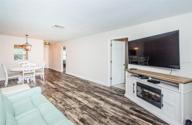 Welcome to low-maintenance Florida living in the guard-gated on Seven Springs Golf and Country Club in Florida - for sale on GolfHomes.com, golf home, golf lot