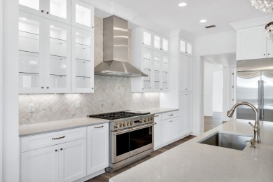 This thoughtfully designed expanded Coral Bean plan by Huff on Origins Golf Club in Florida - for sale on GolfHomes.com, golf home, golf lot