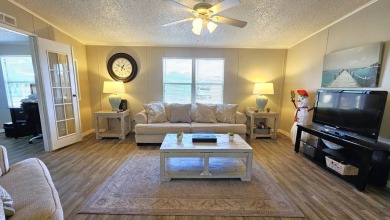 Welcome to paradise in this stunning 2-bedroom, 2-bathroom home on Blue Heron Pines Golf Course in Florida - for sale on GolfHomes.com, golf home, golf lot