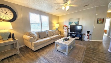 Welcome to paradise in this stunning 2-bedroom, 2-bathroom home on Blue Heron Pines Golf Course in Florida - for sale on GolfHomes.com, golf home, golf lot
