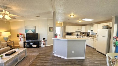 Welcome to paradise in this stunning 2-bedroom, 2-bathroom home on Blue Heron Pines Golf Course in Florida - for sale on GolfHomes.com, golf home, golf lot