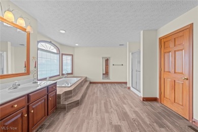 Nestled on the 5th hole of Barrington Golf Course, this brick on Barrington Golf Club in Ohio - for sale on GolfHomes.com, golf home, golf lot