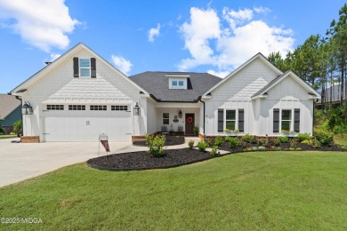 From the moment you arrive at this residence, you will know that on Canongate At Healy Point Country Club in Georgia - for sale on GolfHomes.com, golf home, golf lot