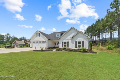 From the moment you arrive at this residence, you will know that on Canongate At Healy Point Country Club in Georgia - for sale on GolfHomes.com, golf home, golf lot