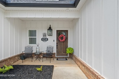 From the moment you arrive at this residence, you will know that on Canongate At Healy Point Country Club in Georgia - for sale on GolfHomes.com, golf home, golf lot