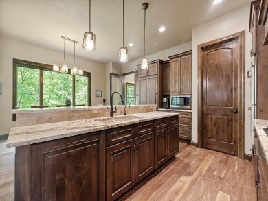 This custom-built, one-level home sits on 2.5 beautifully on Ridges At Sand Creek in Minnesota - for sale on GolfHomes.com, golf home, golf lot