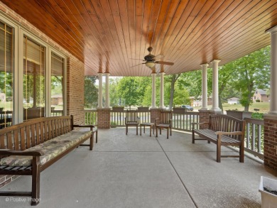 Relax on the huge, welcoming wrap around front porch of this on Flagg Creek Golf Course in Illinois - for sale on GolfHomes.com, golf home, golf lot
