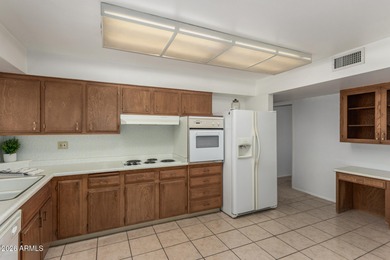 Welcome home to this light and bright 2-bedroom, 2-bath home on Sun City Lakes West and East in Arizona - for sale on GolfHomes.com, golf home, golf lot