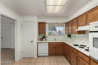 Welcome home to this light and bright 2-bedroom, 2-bath home on Sun City Lakes West and East in Arizona - for sale on GolfHomes.com, golf home, golf lot