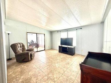 This very affordable two bedroom, two bathroom home is located on Apollo Beach Golf and Sea Club in Florida - for sale on GolfHomes.com, golf home, golf lot