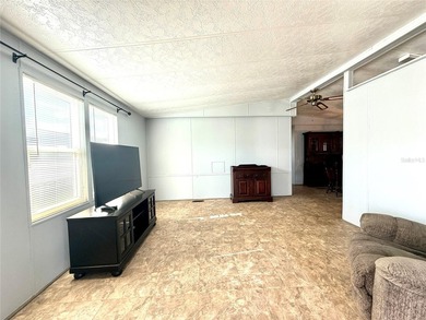 This very affordable two bedroom, two bathroom home is located on Apollo Beach Golf and Sea Club in Florida - for sale on GolfHomes.com, golf home, golf lot