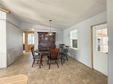 This very affordable two bedroom, two bathroom home is located on Apollo Beach Golf and Sea Club in Florida - for sale on GolfHomes.com, golf home, golf lot