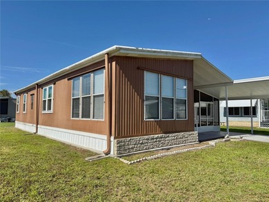 This very affordable two bedroom, two bathroom home is located on Apollo Beach Golf and Sea Club in Florida - for sale on GolfHomes.com, golf home, golf lot