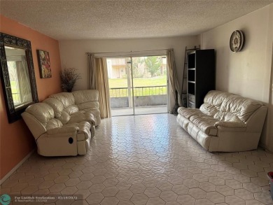 SPACIOUS UPGRADED 3 BEDROOMS, 2 BATHROOMS FIRST FLOOR FALLS OF on Inverrary Country Club in Florida - for sale on GolfHomes.com, golf home, golf lot