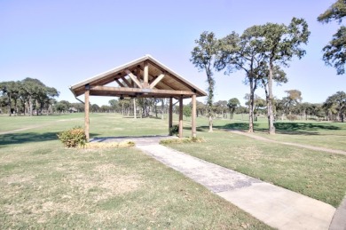 This exceptionally-updated 3 bedroom, 3 bathroom brick home in on Cedar Creek Country Club in Texas - for sale on GolfHomes.com, golf home, golf lot