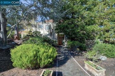 Nestled at the end of the drive, this rare end-unit level-in on Rossmoor Golf Course in California - for sale on GolfHomes.com, golf home, golf lot