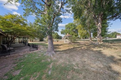 This beautifully maintained 4-bedroom, 3-bathroom home is on Indian Springs Country Club in Oklahoma - for sale on GolfHomes.com, golf home, golf lot