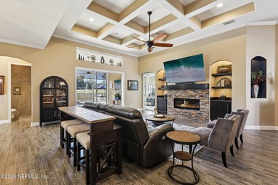 Stunning pool home with a pond to golf course view in gated on Magnolia Point Golf and Country Club in Florida - for sale on GolfHomes.com, golf home, golf lot