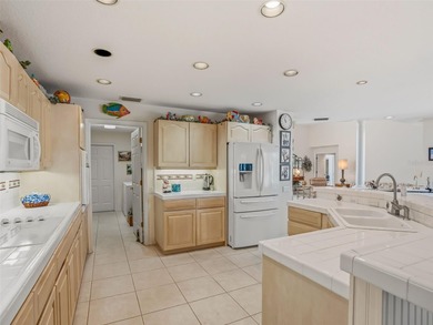 This elegant, spacious residence is set on a beautifully on Harbor Hills Country Club in Florida - for sale on GolfHomes.com, golf home, golf lot