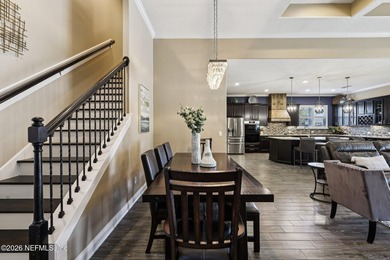 Stunning pool home with a pond to golf course view in gated on Magnolia Point Golf and Country Club in Florida - for sale on GolfHomes.com, golf home, golf lot