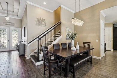 Stunning pool home with a pond to golf course view in gated on Magnolia Point Golf and Country Club in Florida - for sale on GolfHomes.com, golf home, golf lot