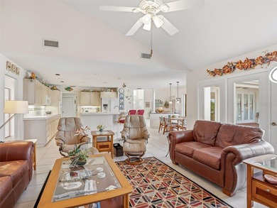 This elegant, spacious residence is set on a beautifully on Harbor Hills Country Club in Florida - for sale on GolfHomes.com, golf home, golf lot