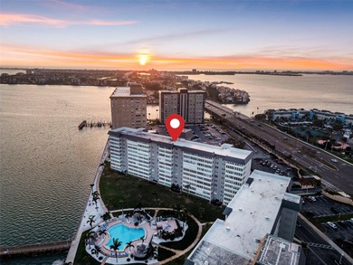 Welcome to waterfront living at its finest in Point Brittany; on Isla Del Sol Yacht and Country Club in Florida - for sale on GolfHomes.com, golf home, golf lot