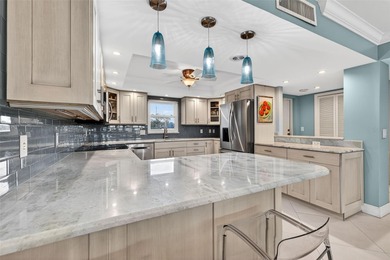 Welcome to waterfront living at its finest in Point Brittany; on Isla Del Sol Yacht and Country Club in Florida - for sale on GolfHomes.com, golf home, golf lot