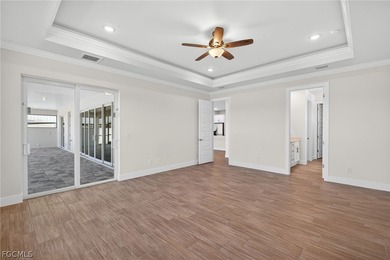 Live the Southwest Florida dream in this award-winning new on Palmetto-Pine Country Club in Florida - for sale on GolfHomes.com, golf home, golf lot