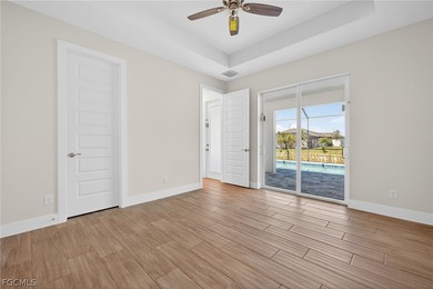 Live the Southwest Florida dream in this award-winning new on Palmetto-Pine Country Club in Florida - for sale on GolfHomes.com, golf home, golf lot