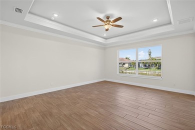 Live the Southwest Florida dream in this award-winning new on Palmetto-Pine Country Club in Florida - for sale on GolfHomes.com, golf home, golf lot