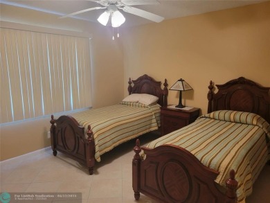 ELEGANT, IMMACULATE AND SPACIOUS UNIT WITH SERENE VIEWS OF GOLF on Wynmoor Golf Course in Florida - for sale on GolfHomes.com, golf home, golf lot