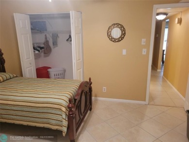 ELEGANT, IMMACULATE AND SPACIOUS UNIT WITH SERENE VIEWS OF GOLF on Wynmoor Golf Course in Florida - for sale on GolfHomes.com, golf home, golf lot