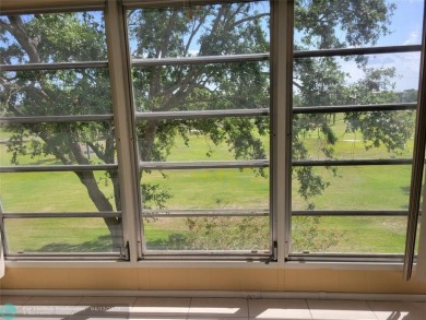 ELEGANT, IMMACULATE AND SPACIOUS UNIT WITH SERENE VIEWS OF GOLF on Wynmoor Golf Course in Florida - for sale on GolfHomes.com, golf home, golf lot