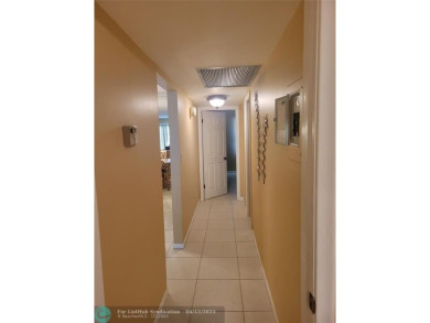 ELEGANT, IMMACULATE AND SPACIOUS UNIT WITH SERENE VIEWS OF GOLF on Wynmoor Golf Course in Florida - for sale on GolfHomes.com, golf home, golf lot