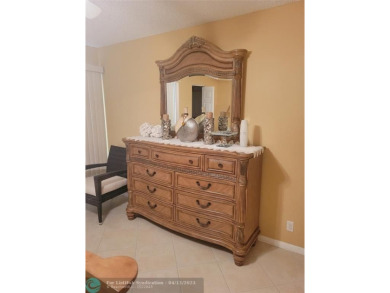 ELEGANT, IMMACULATE AND SPACIOUS UNIT WITH SERENE VIEWS OF GOLF on Wynmoor Golf Course in Florida - for sale on GolfHomes.com, golf home, golf lot