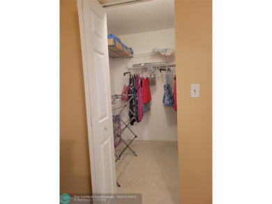 ELEGANT, IMMACULATE AND SPACIOUS UNIT WITH SERENE VIEWS OF GOLF on Wynmoor Golf Course in Florida - for sale on GolfHomes.com, golf home, golf lot